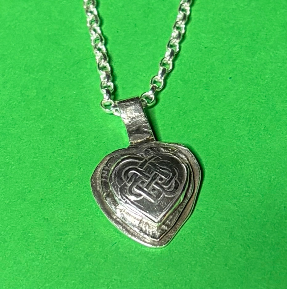 Handmade sterling silver Celtic heart with background on 18 or 20 inch chain.