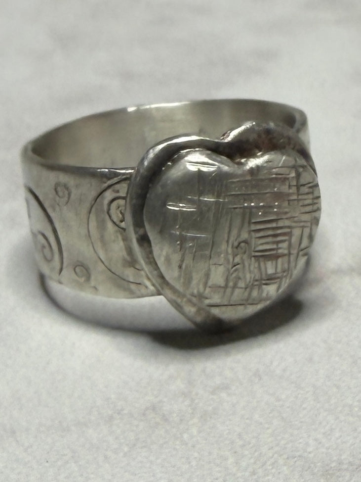 Handmade sterling silver with Triskele and love heart. Thick band, size R