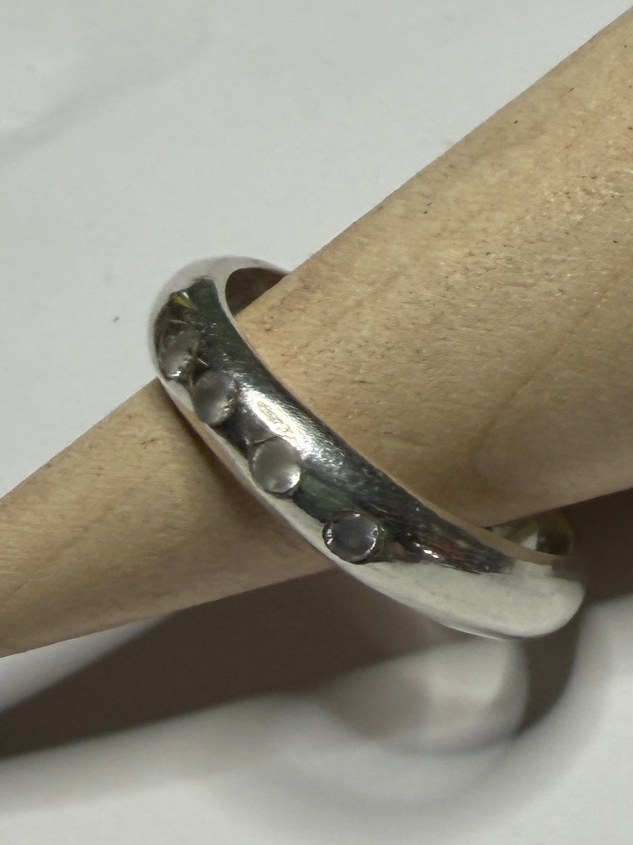 Handmade sterling silver ring with flush set stones. White stones. Size N