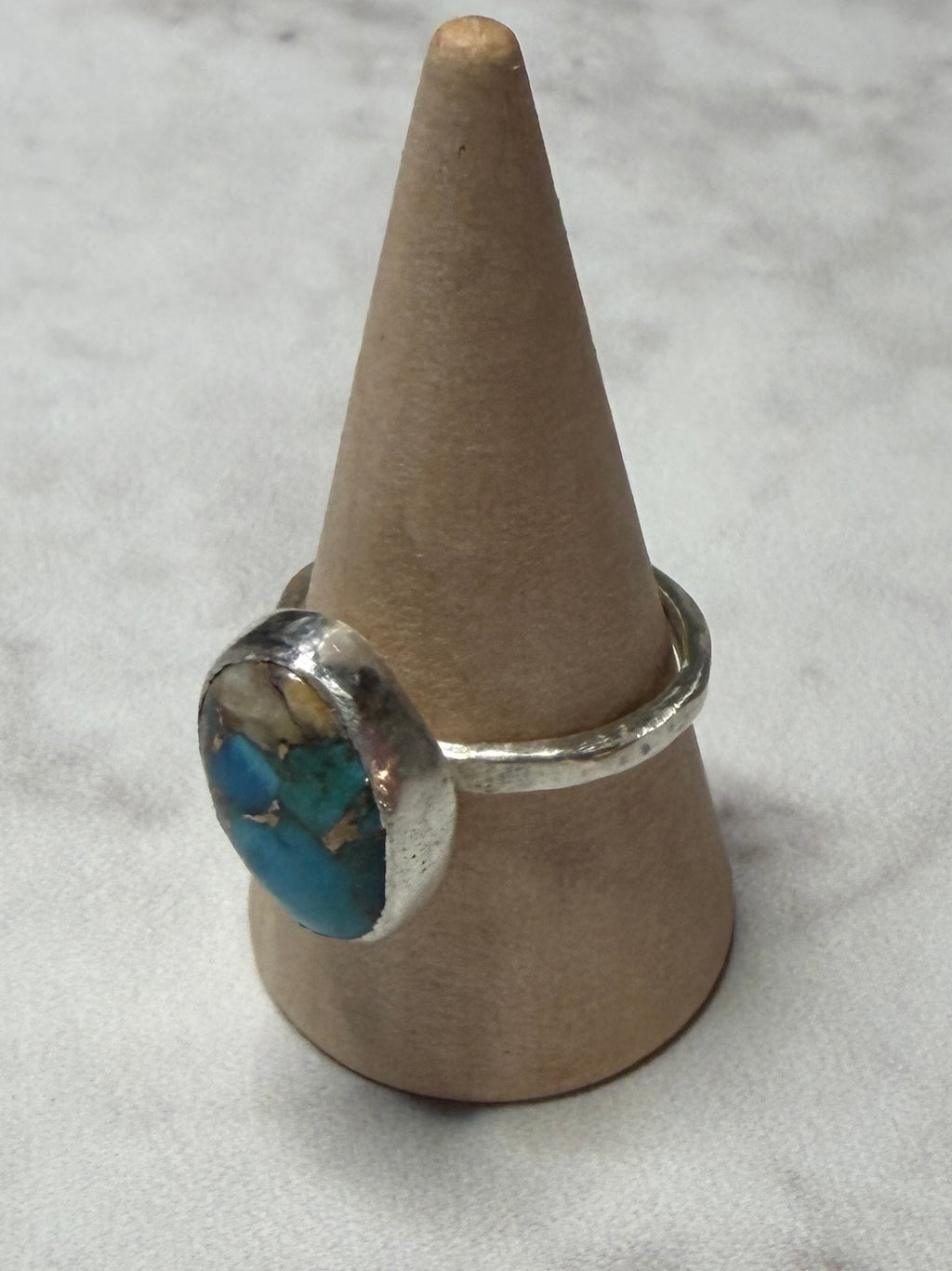 Handmade sterling silver ring with turquoise stone. Size O