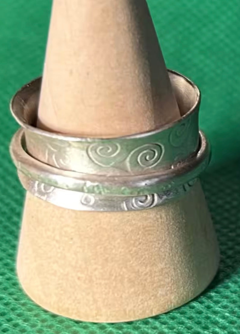 Hand made silver spinner anti anxiety fidget ring. Triskele spiral design