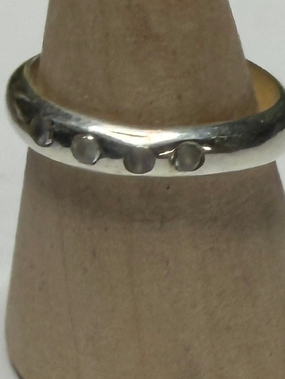 Handmade sterling silver ring with flush set stones. White stones. Size N