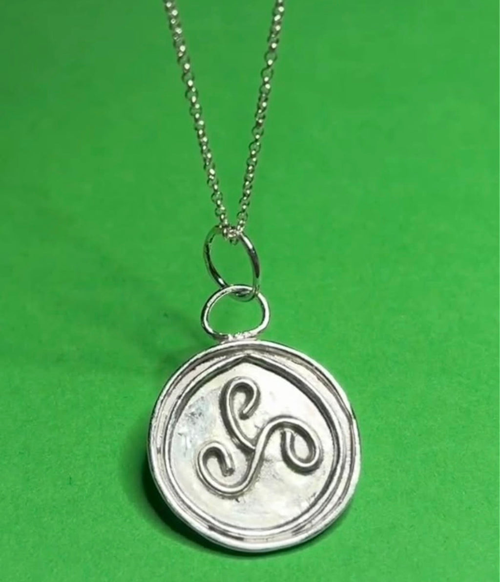 Handmade silver triskele pendant on an 18 inch necklace
