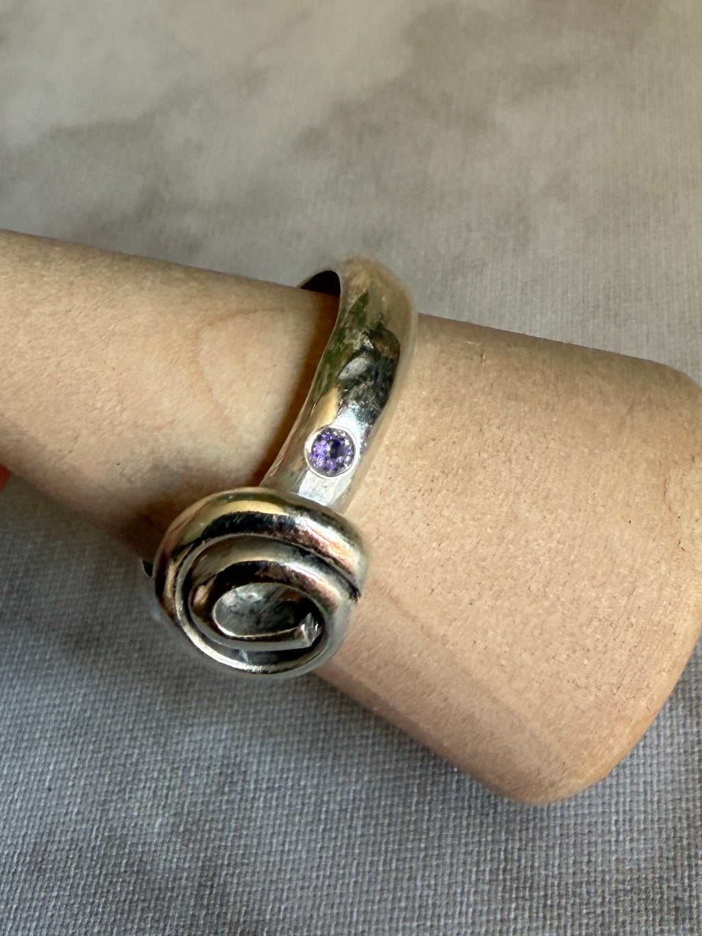 Handmade sterling silver Celtic swirl with purple flush set CZ stones