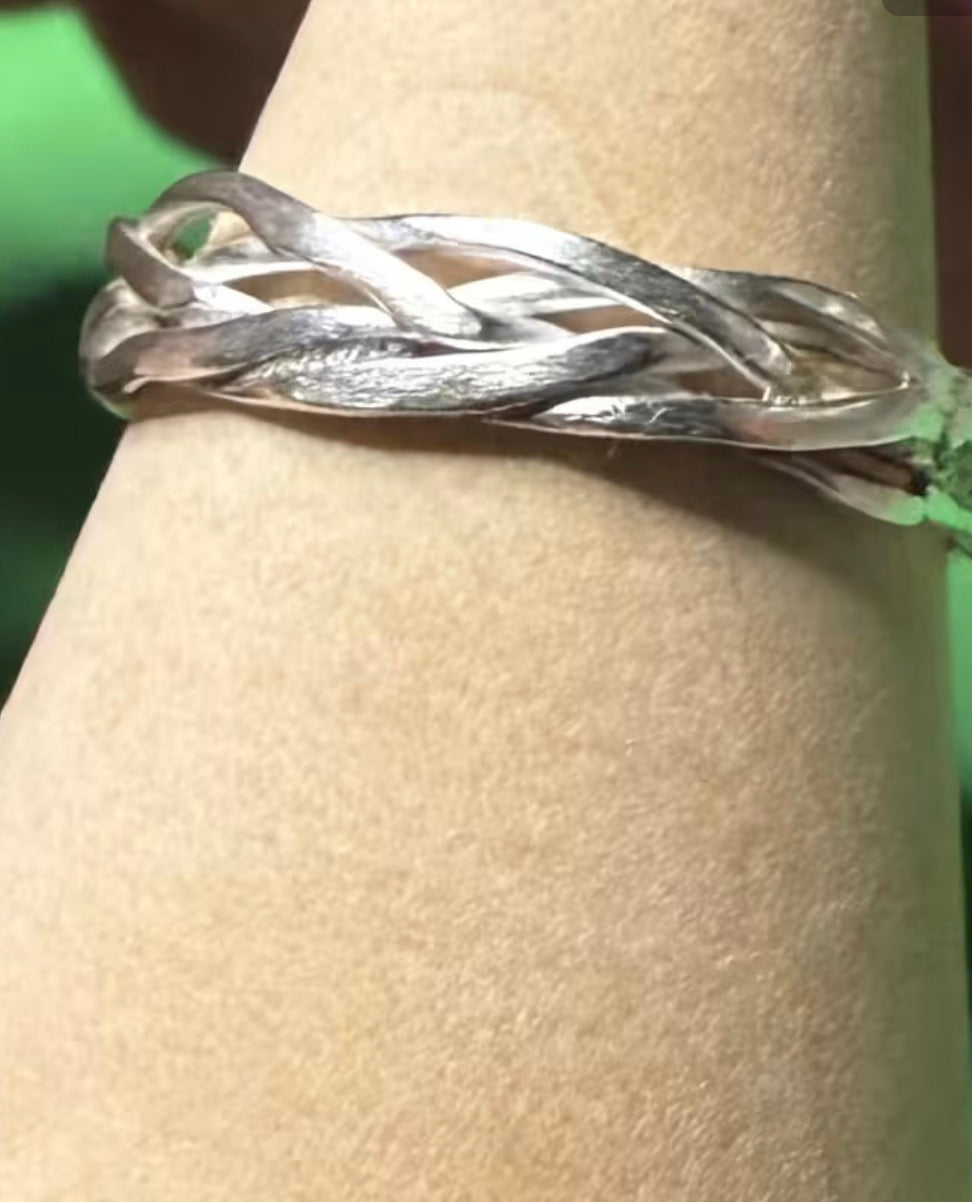 Hand made silver Celtic twist with triskele ring. Size L