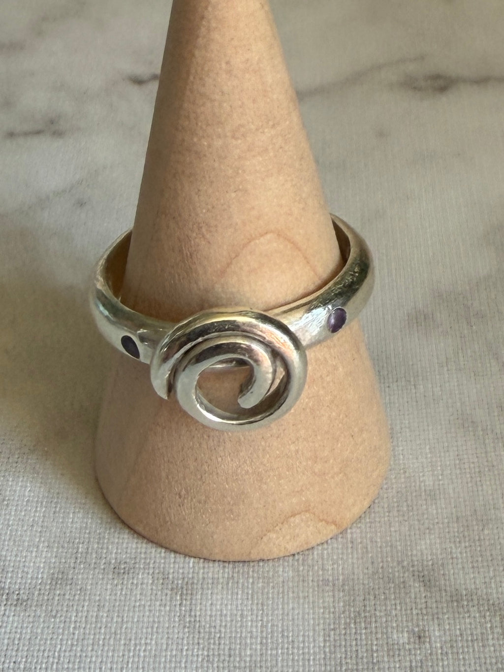 Handmade sterling silver Celtic swirl with purple flush set CZ stones