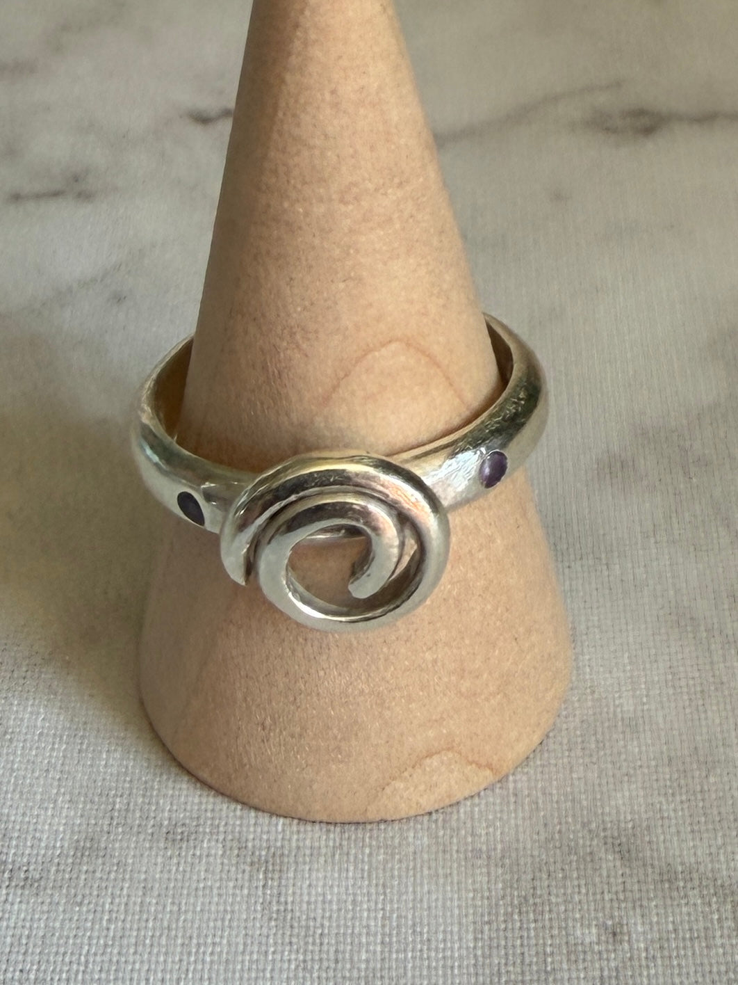 Handmade sterling silver Celtic swirl with purple flush set CZ stones