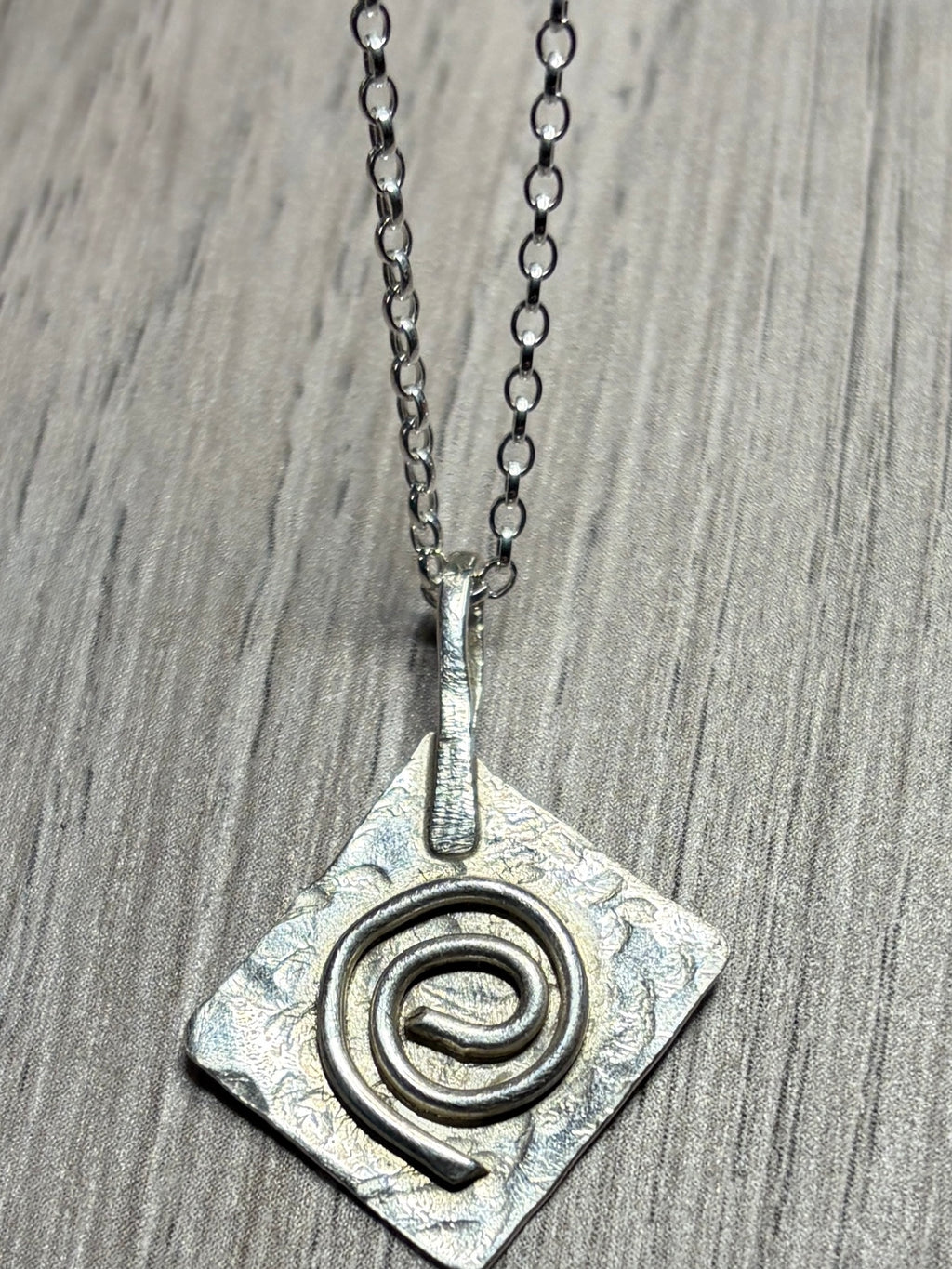 Handmade sterling silver Celtic swirl pendant on 20inch chain.