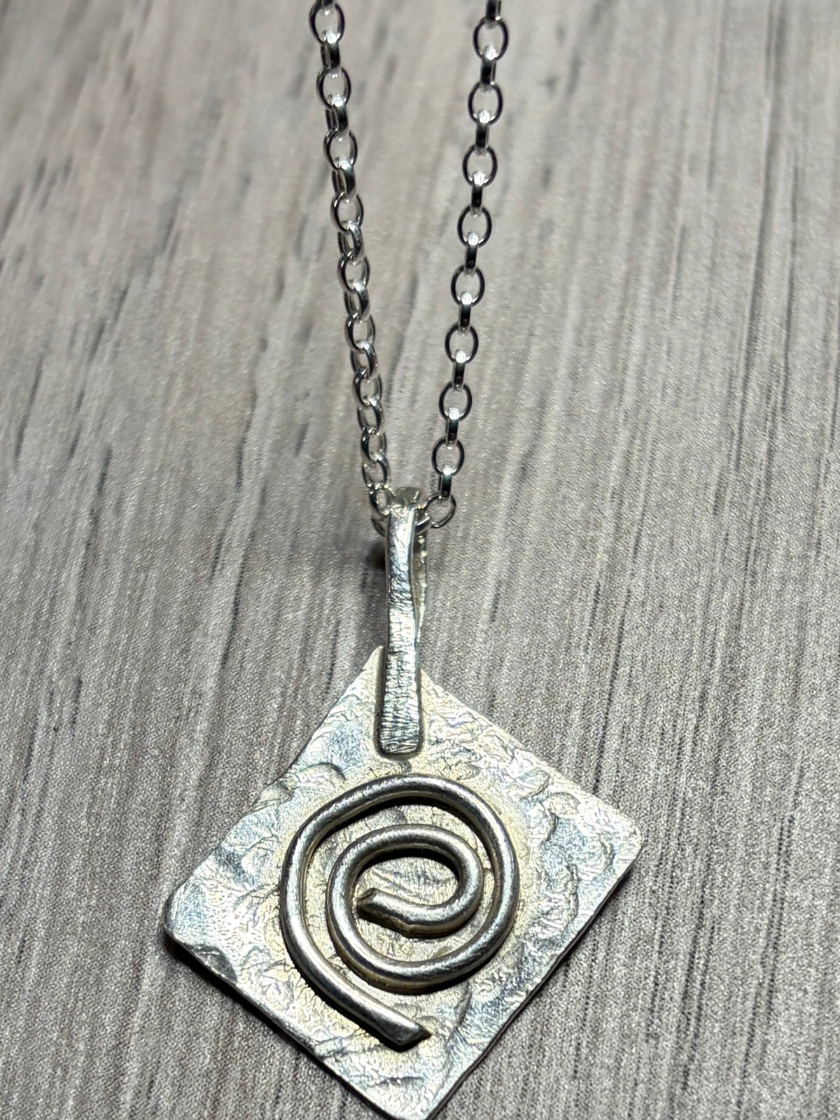 Handmade sterling silver Celtic swirl pendant on 20inch chain.