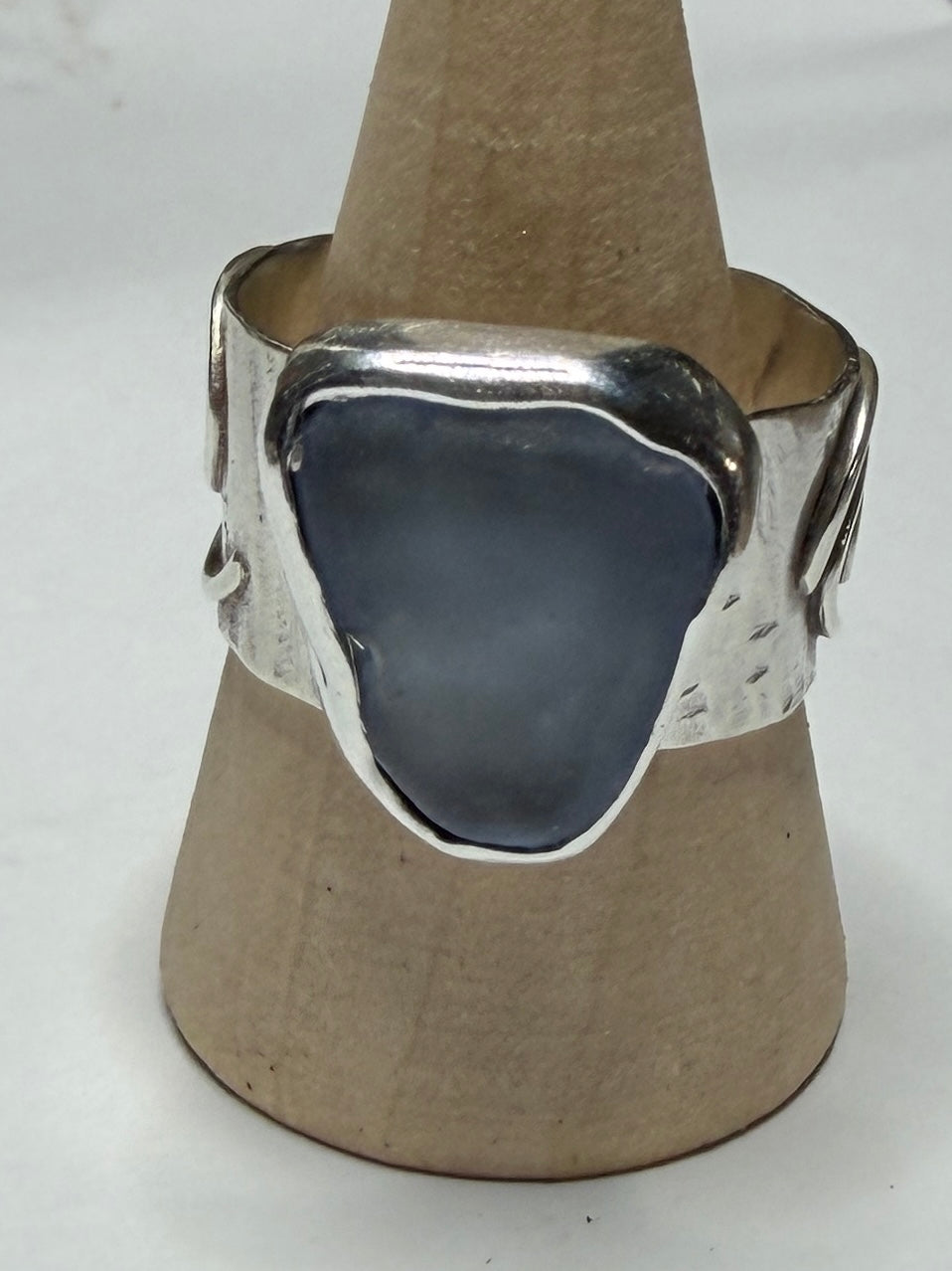 Handmade sterling silver swirl ring with blue sea glass. Size R