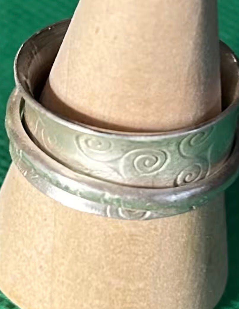 Hand made silver spinner anti anxiety fidget ring. Triskele spiral design