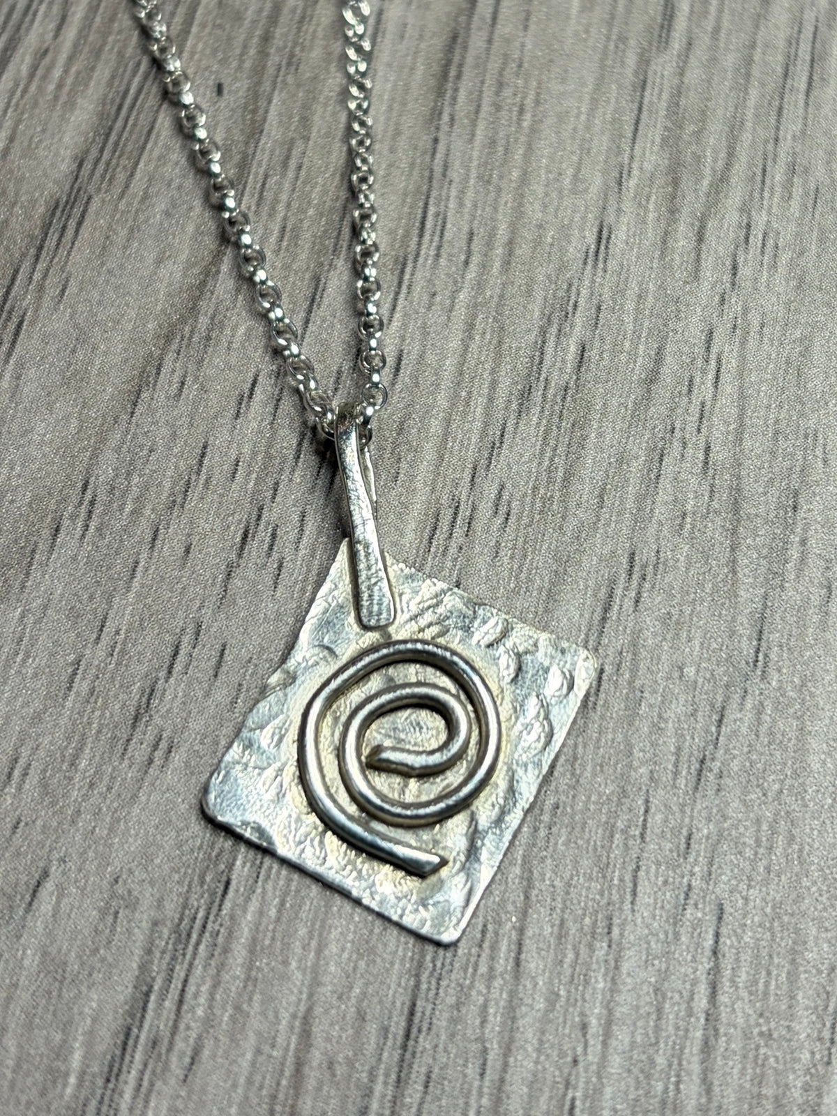 Handmade sterling silver Celtic swirl pendant on 20inch chain.