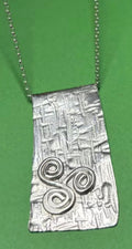 Handmade sterling silver triskele long pendant on an 18 inch necklace