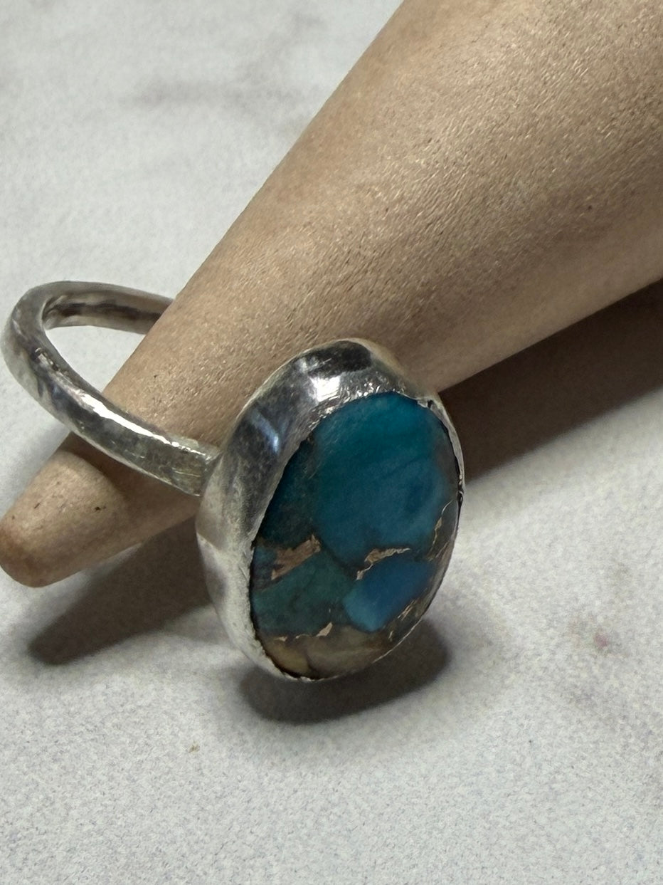 Handmade sterling silver ring with turquoise stone. Size O