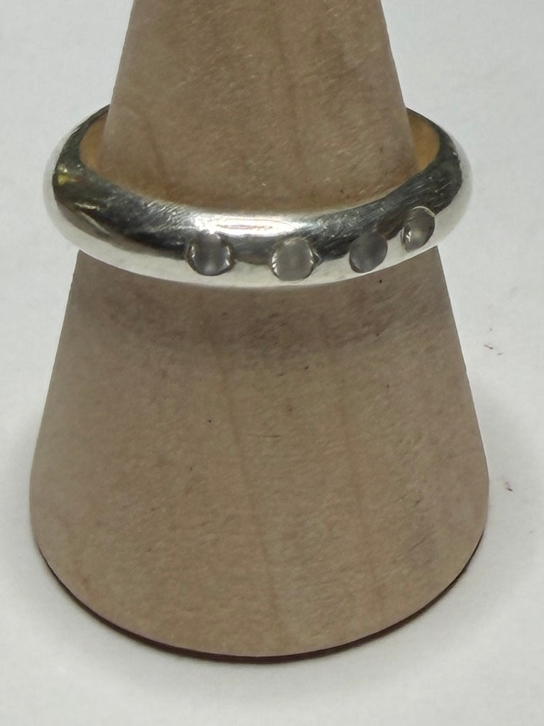 Handmade sterling silver ring with flush set stones. White stones. Size N