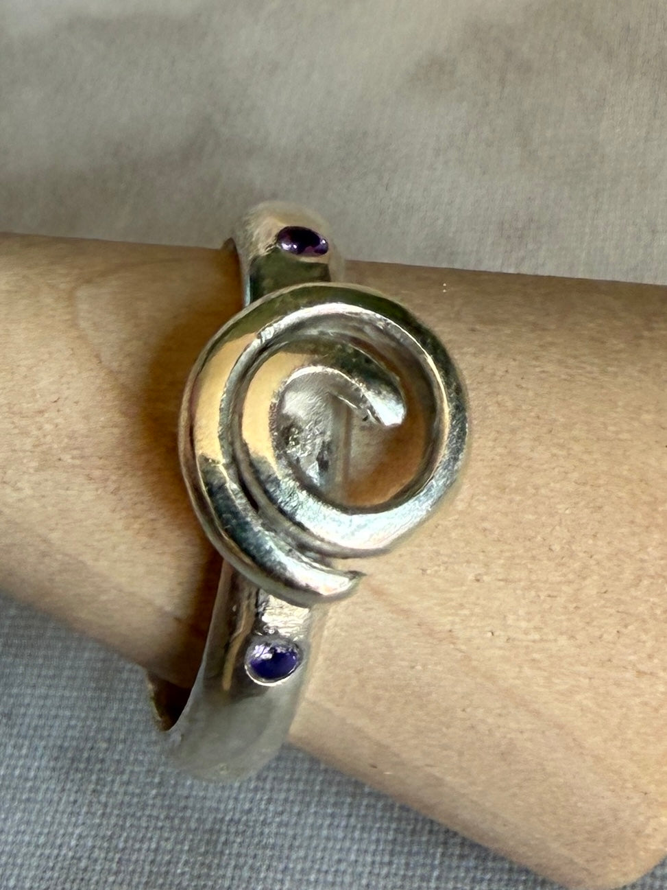 Handmade sterling silver Celtic swirl with purple flush set CZ stones