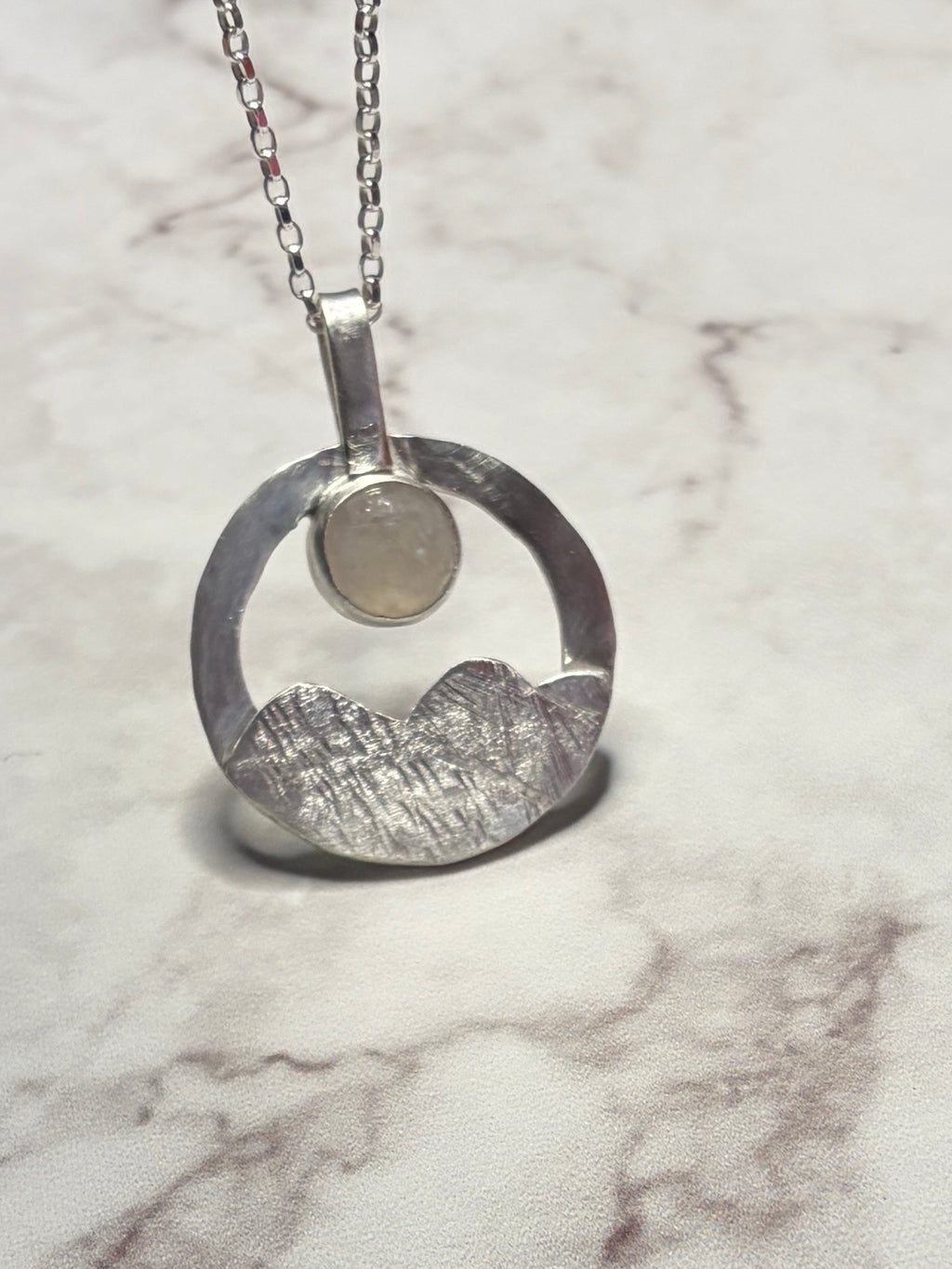 Sterling silver pendant with moonstone on an 18inch chain.