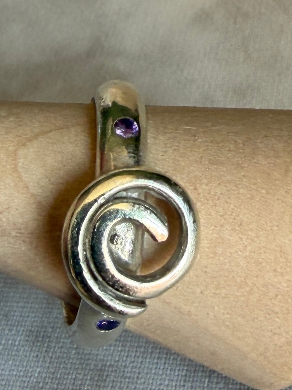 Handmade sterling silver Celtic swirl with purple flush set CZ stones