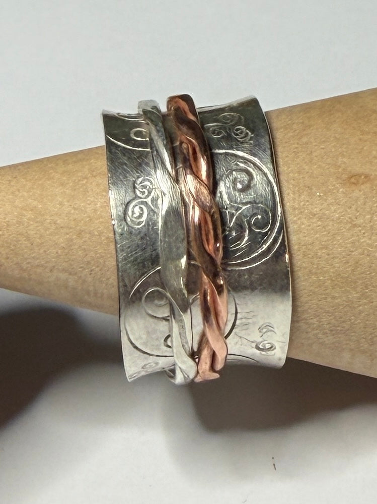 Handmade sterling silver Celtic Triskele spinner with copper inner ring. Fidget anxiety ring
