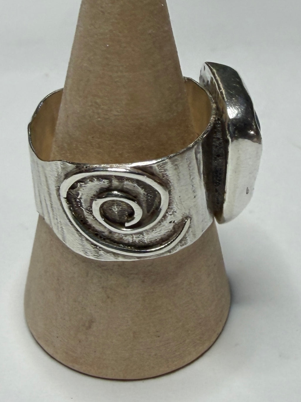 Handmade sterling silver swirl ring with blue sea glass. Size R