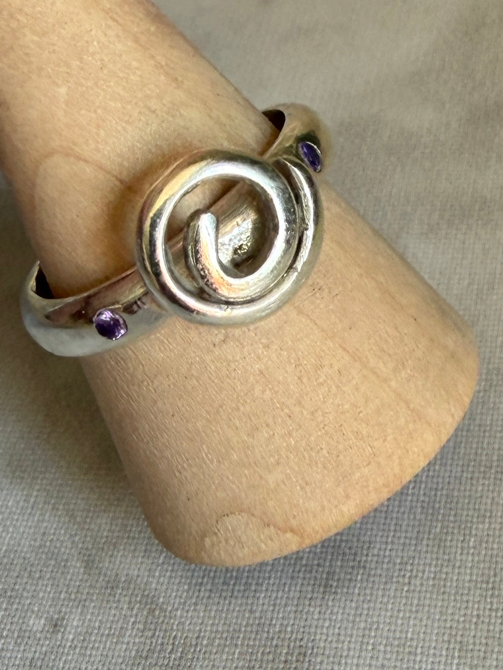 Handmade sterling silver Celtic swirl with purple flush set CZ stones