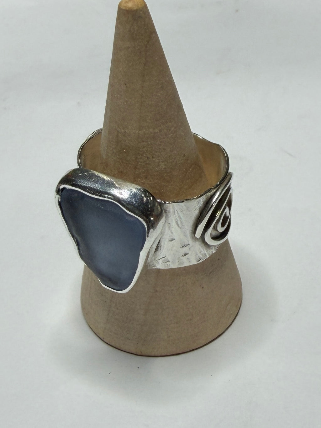 Handmade sterling silver swirl ring with blue sea glass. Size R