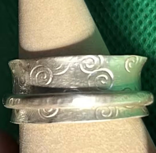 Hand made silver spinner anti anxiety fidget ring. Triskele spiral design