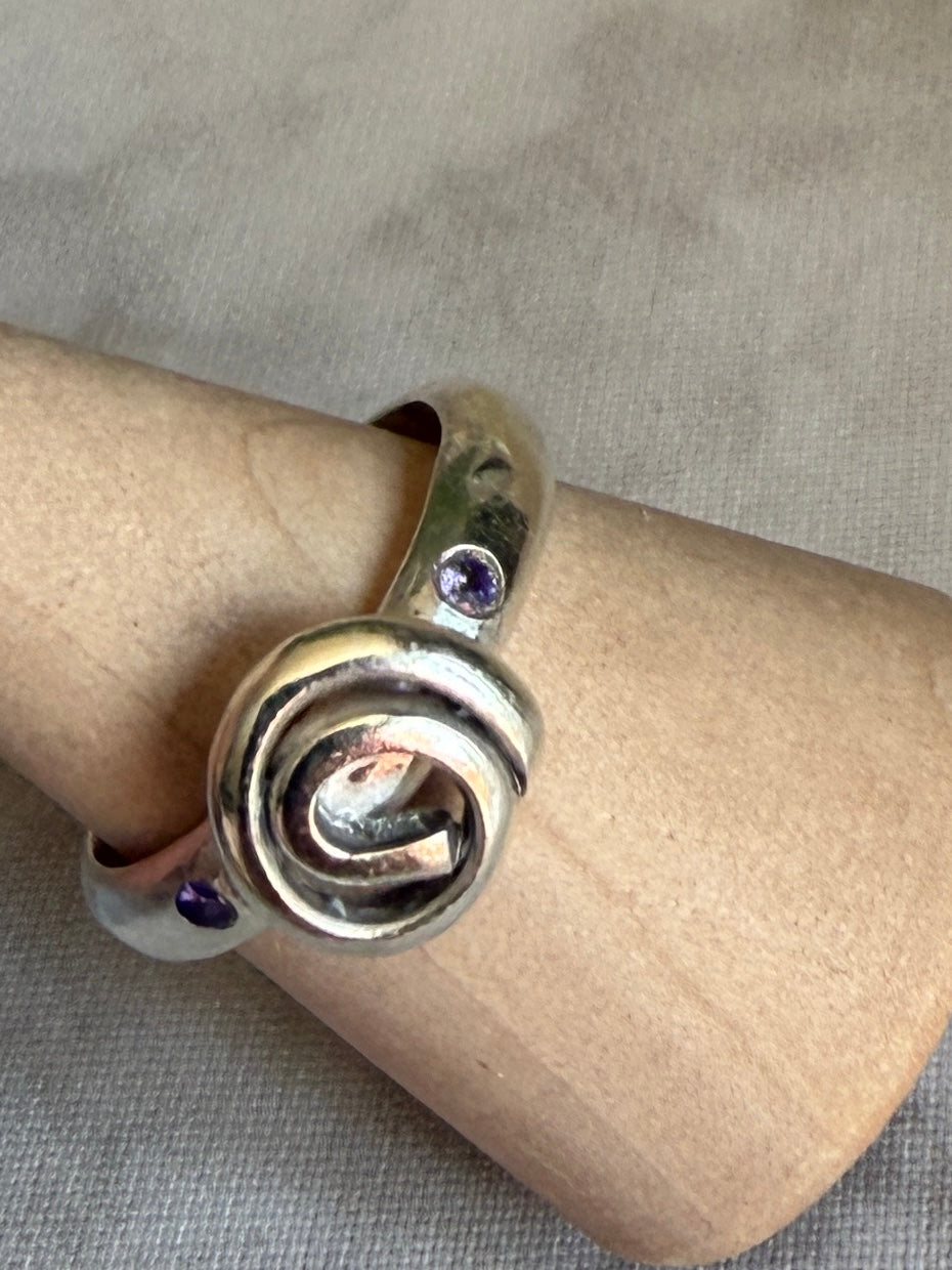 Handmade sterling silver Celtic swirl with purple flush set CZ stones