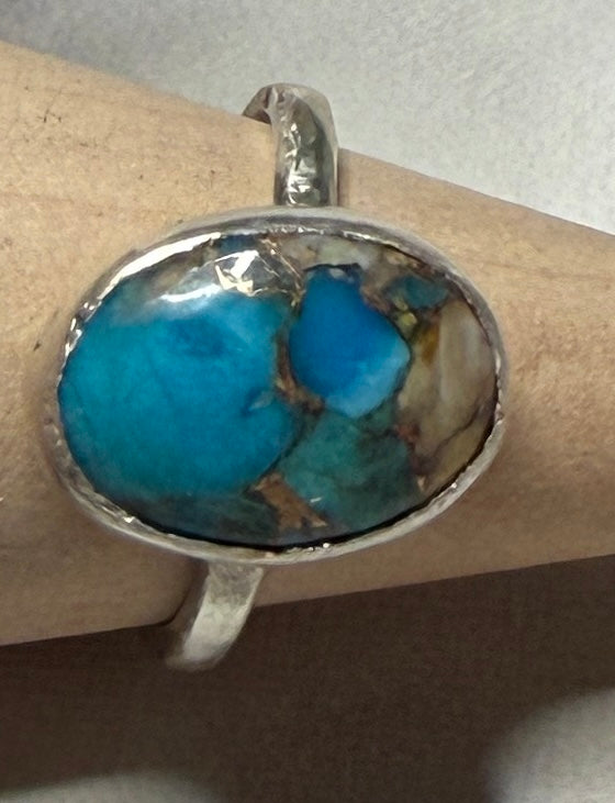 Handmade sterling silver ring with turquoise stone. Size O