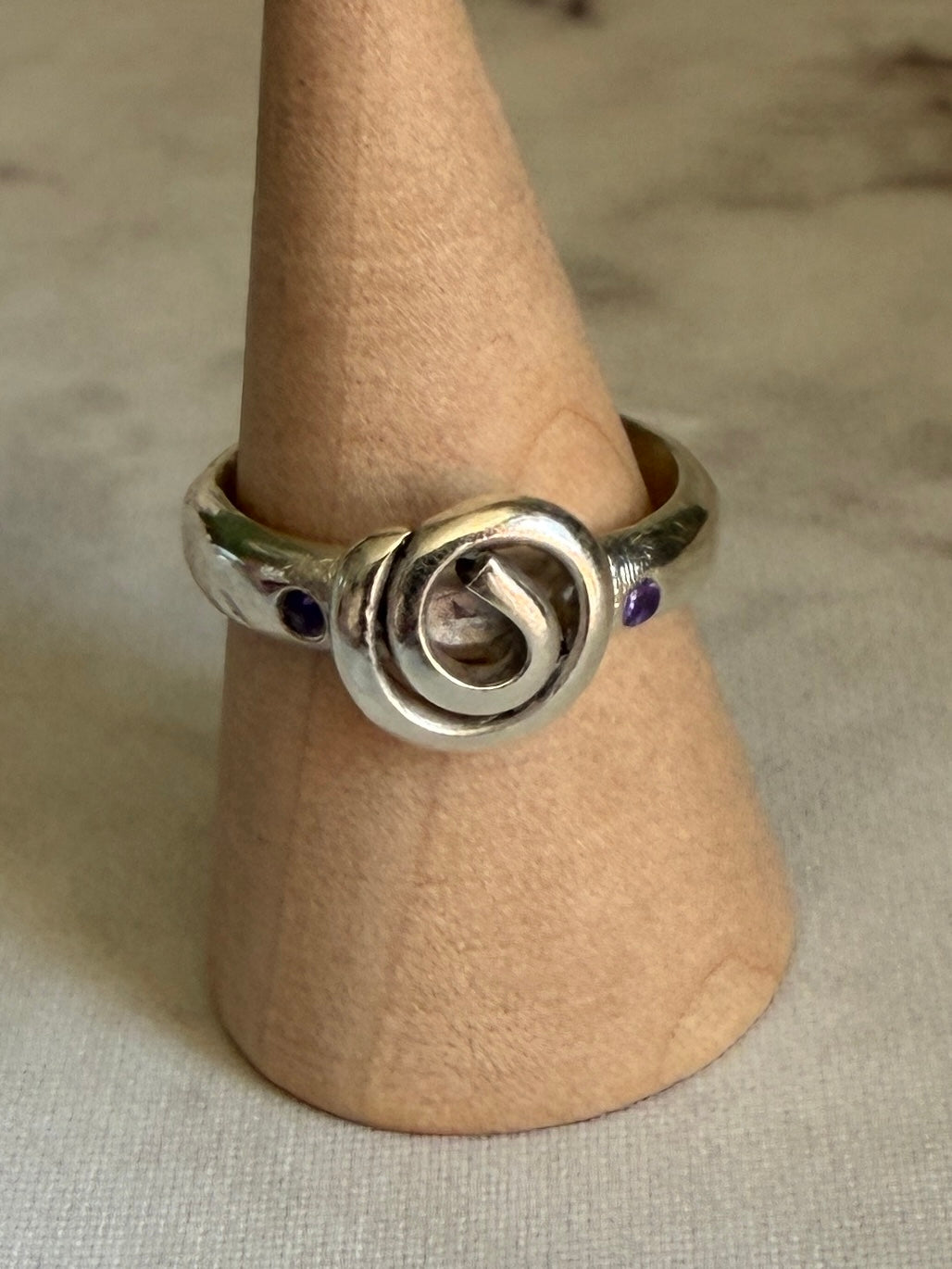Handmade sterling silver Celtic swirl with purple flush set CZ stones