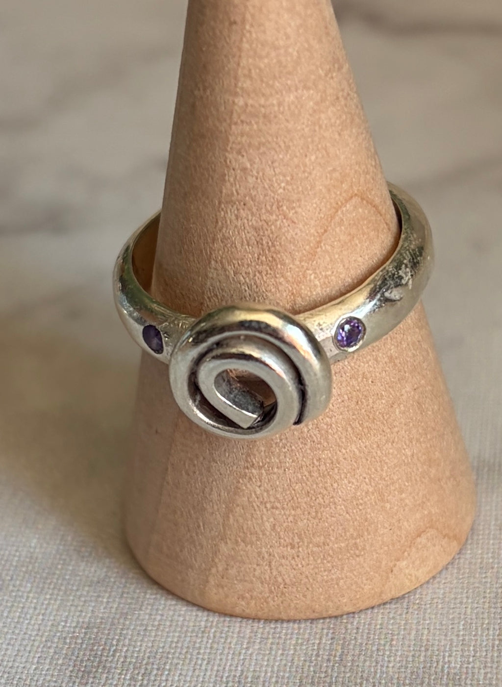 Handmade sterling silver Celtic swirl with purple flush set CZ stones