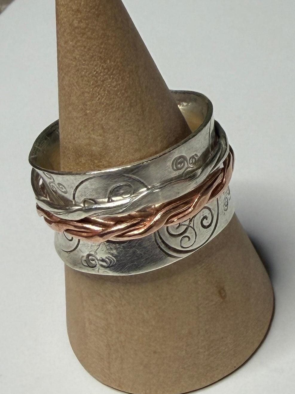 Handmade sterling silver Celtic Triskele spinner with copper inner ring. Fidget anxiety ring