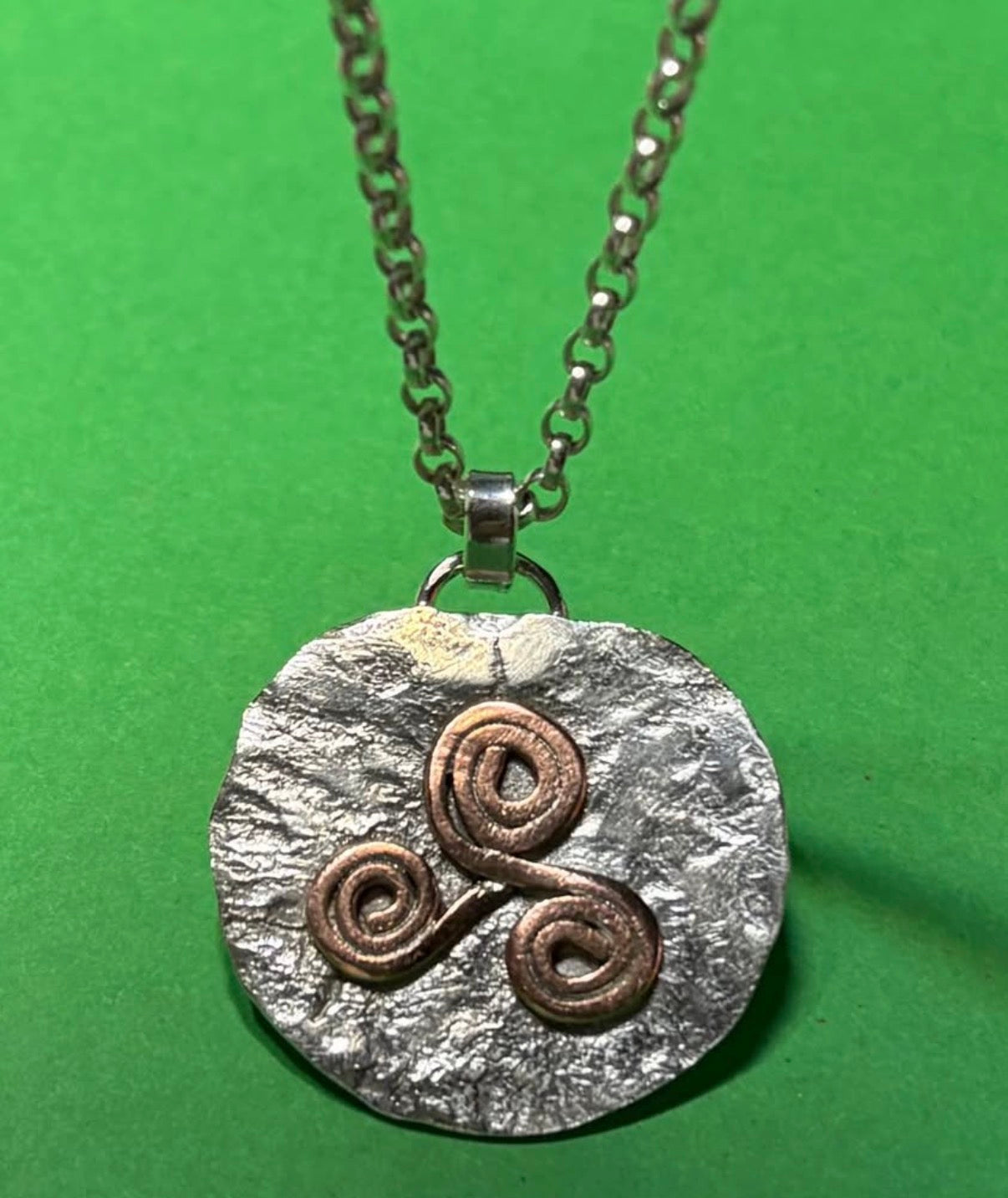 Handmade Sterling Silver pendant with copper Triskele. Choice of 18 or 20 inch chain