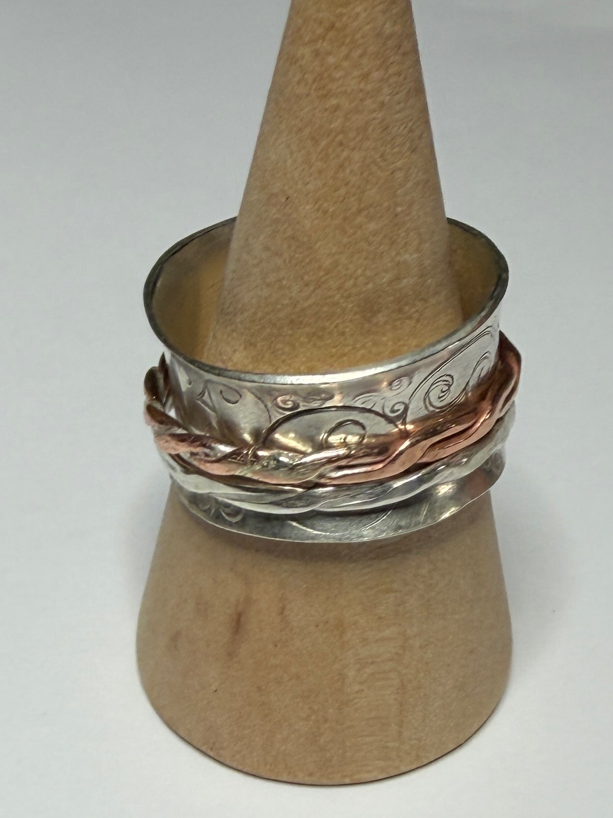Handmade sterling silver Celtic Triskele spinner with copper inner ring. Fidget anxiety ring