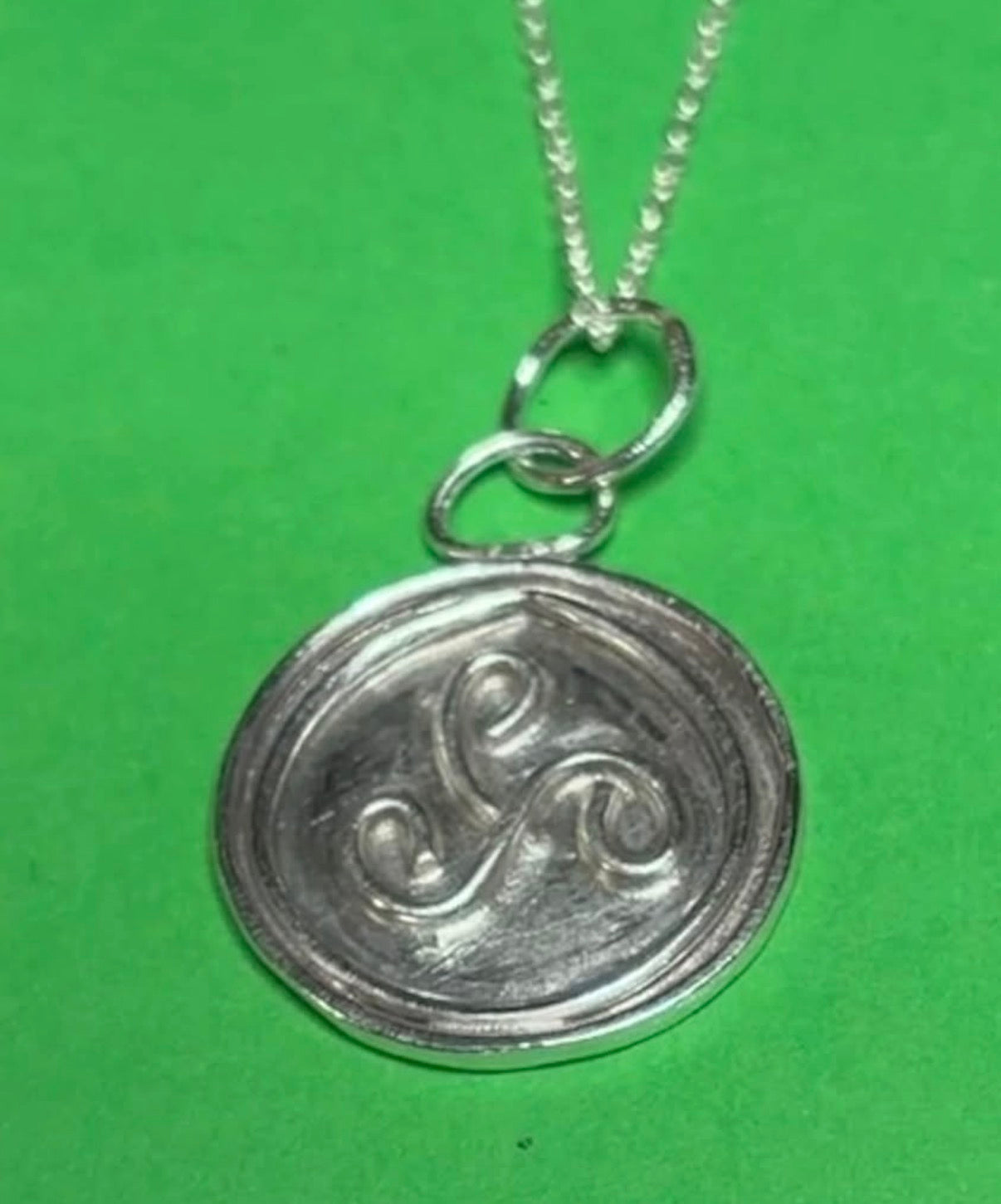 Handmade silver triskele pendant on an 18 inch necklace