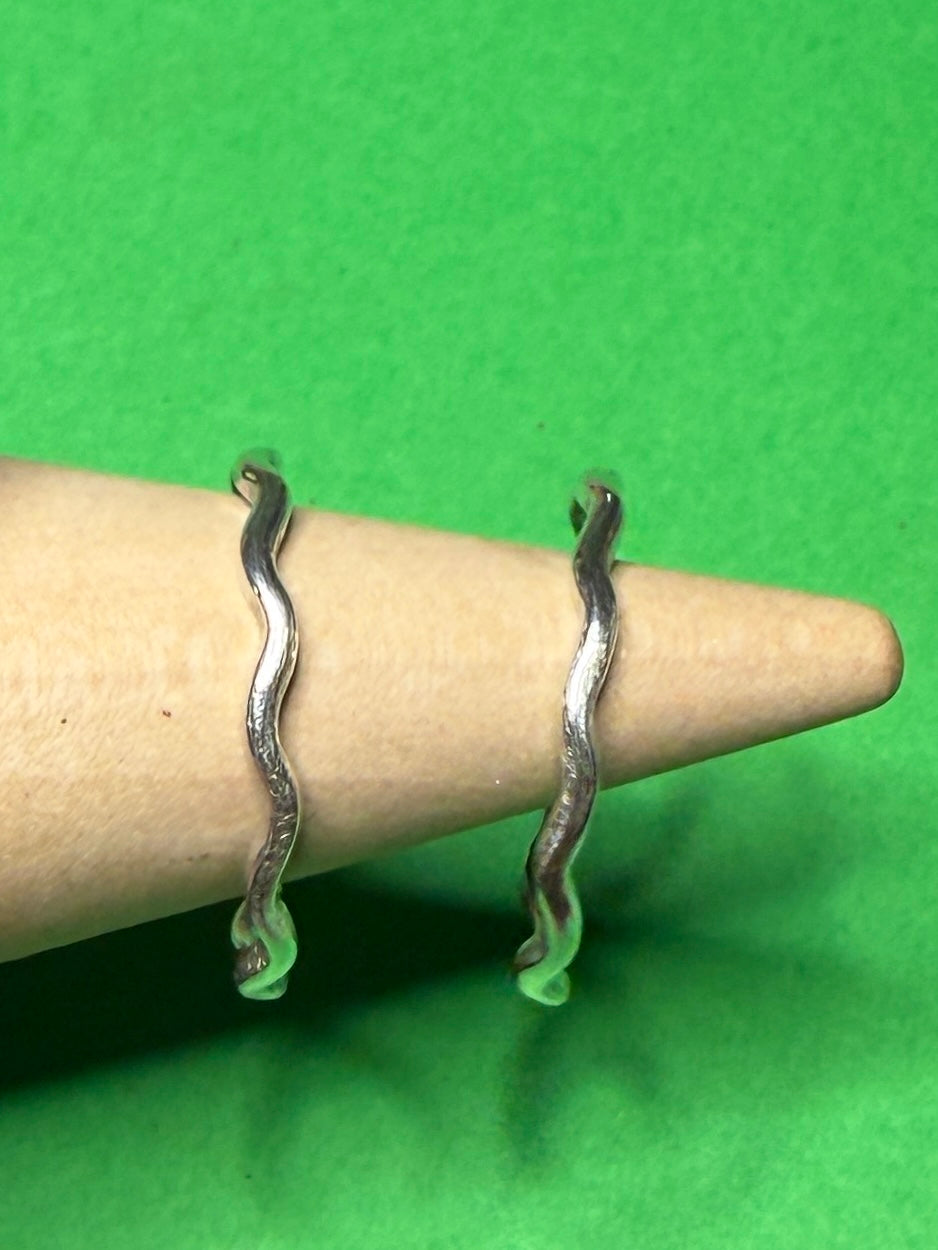 Handmade sterling silver wave ring. Two rings together.