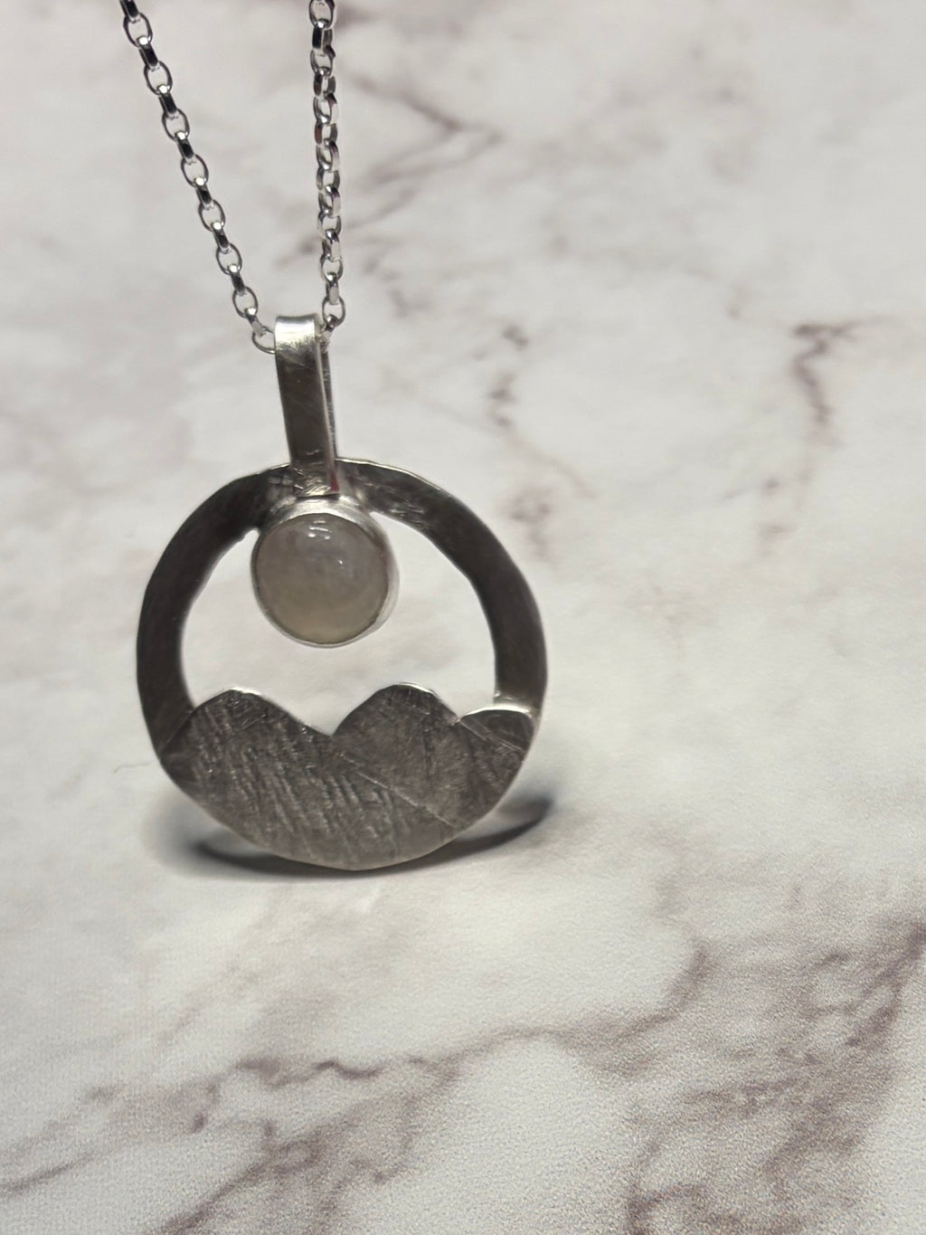 Sterling silver pendant with moonstone on an 18inch chain.