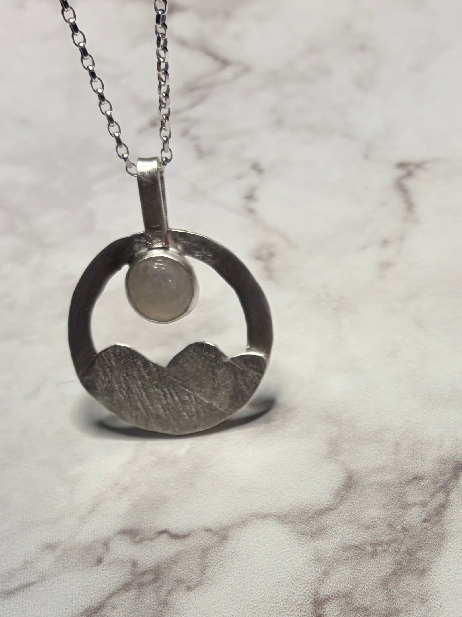 Sterling silver pendant with moonstone on an 18inch chain.