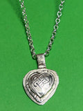Handmade sterling silver Celtic heart with background on 18 or 20 inch chain.