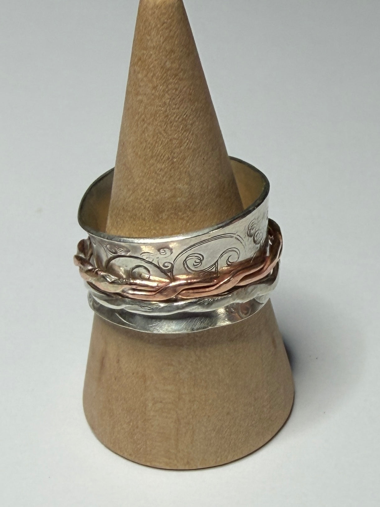 Handmade sterling silver Celtic Triskele spinner with copper inner ring. Fidget anxiety ring
