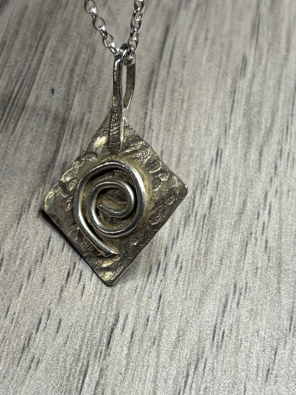 Handmade sterling silver Celtic swirl pendant on 20inch chain.