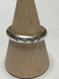 Handmade sterling silver ring with flush set stones. White stones. Size N