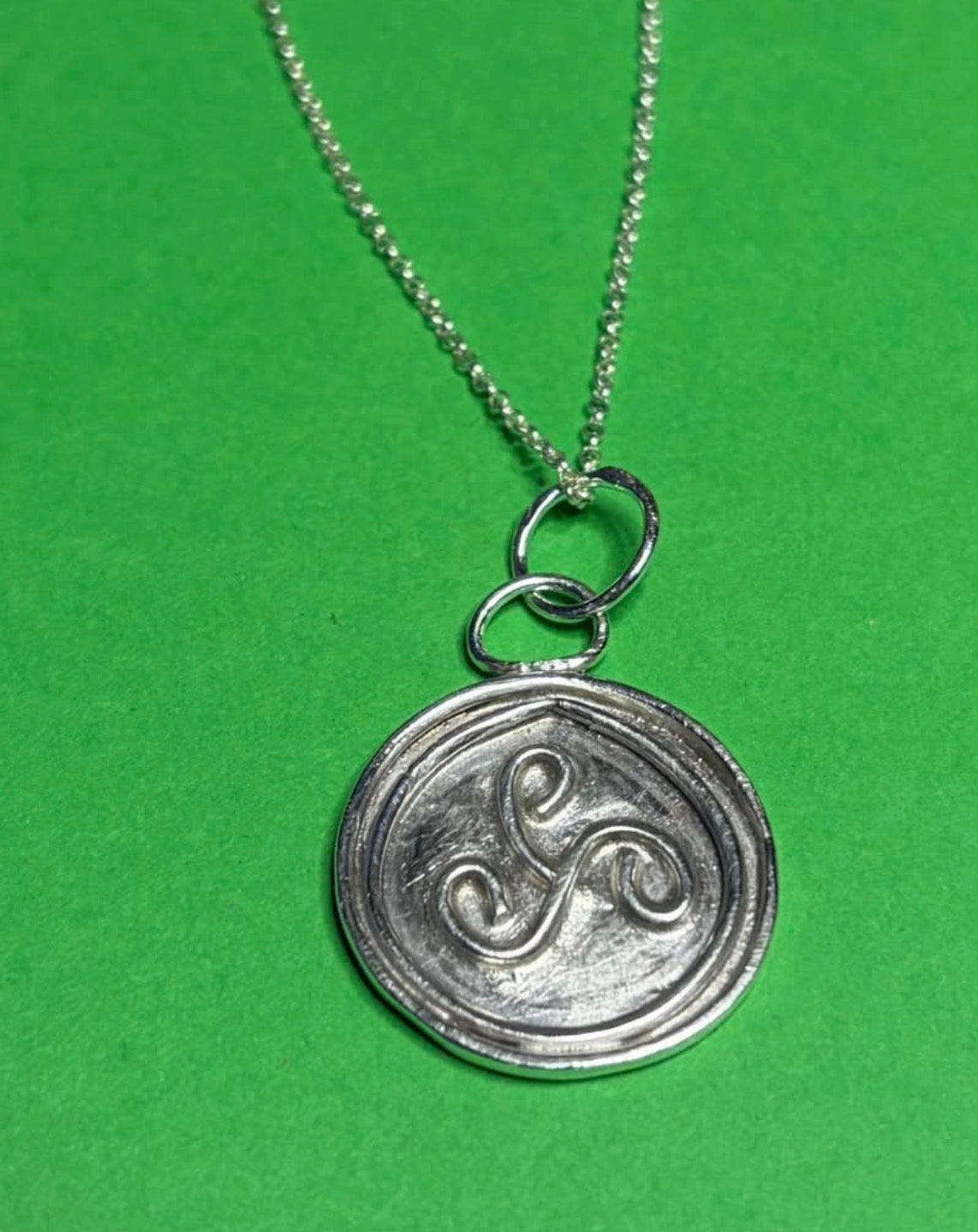 Handmade silver triskele pendant on an 18 inch necklace