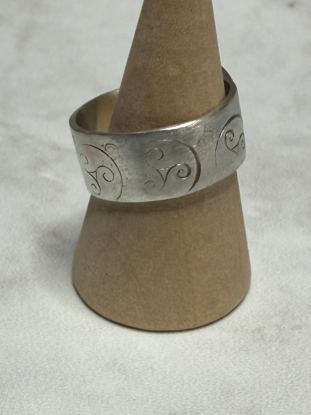 Handmade sterling silver with Triskele and love heart. Thick band, size R