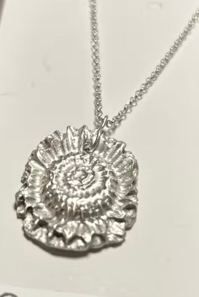 Handmade solid fine silver flower pendant on an 18 inch necklace