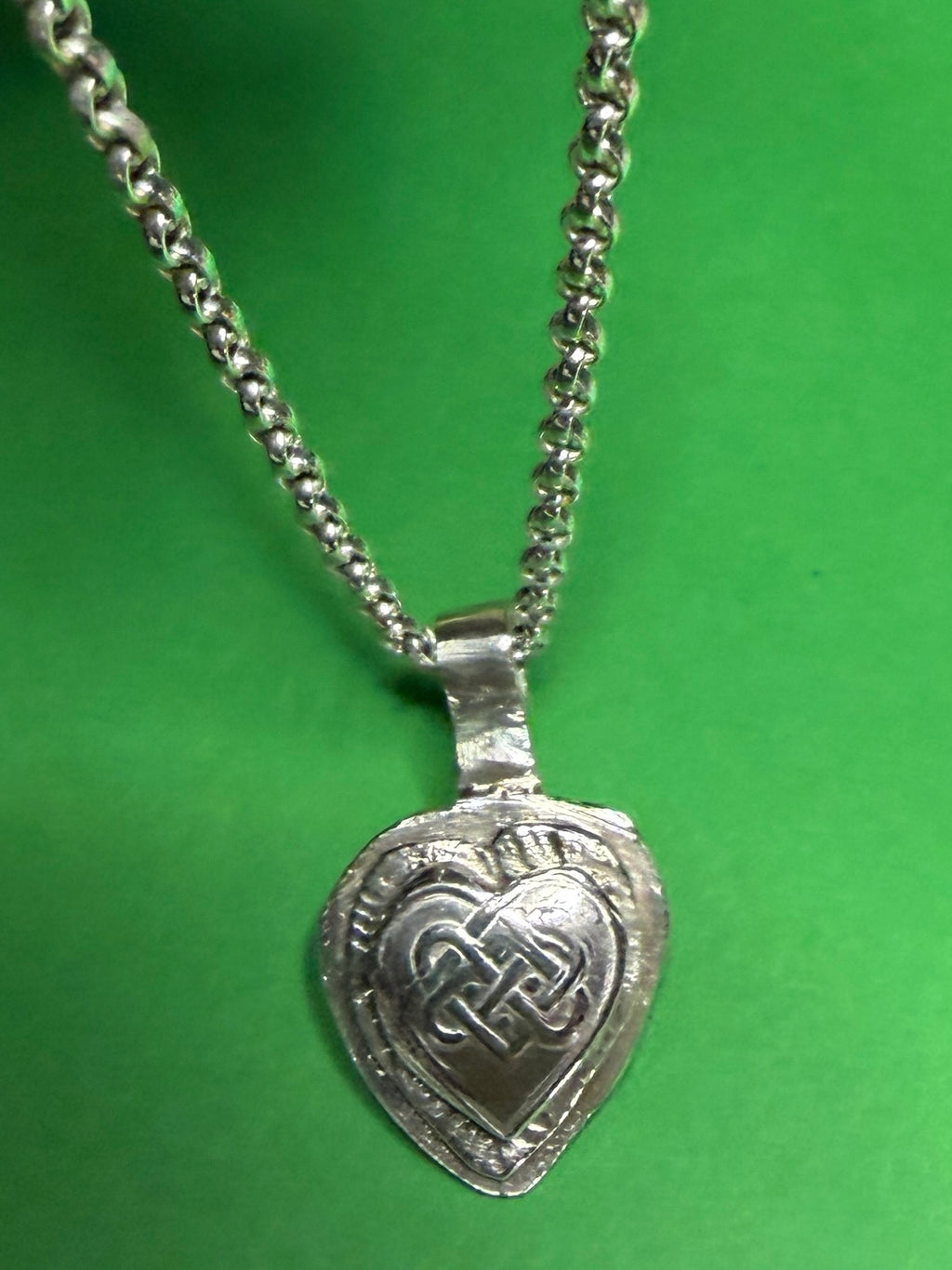 Handmade sterling silver Celtic heart with background on 18 or 20 inch chain.
