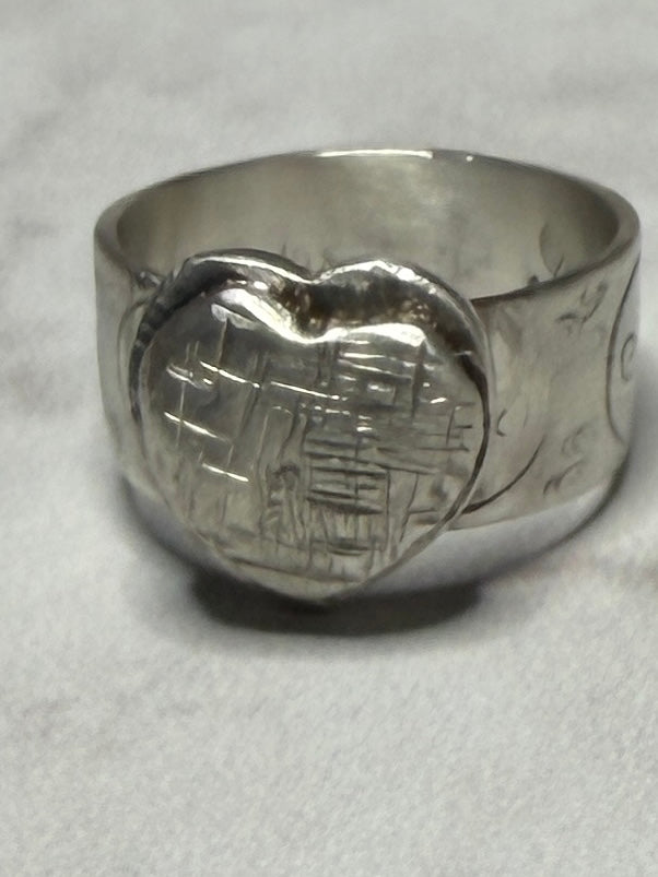 Handmade sterling silver with Triskele and love heart. Thick band, size R