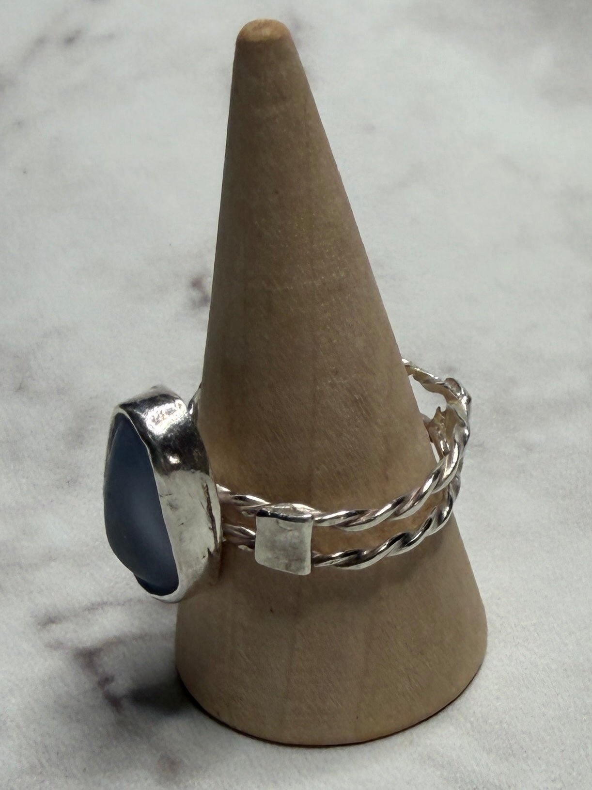 Handmade sterling silver double twist band with blue sea glass. Size Q