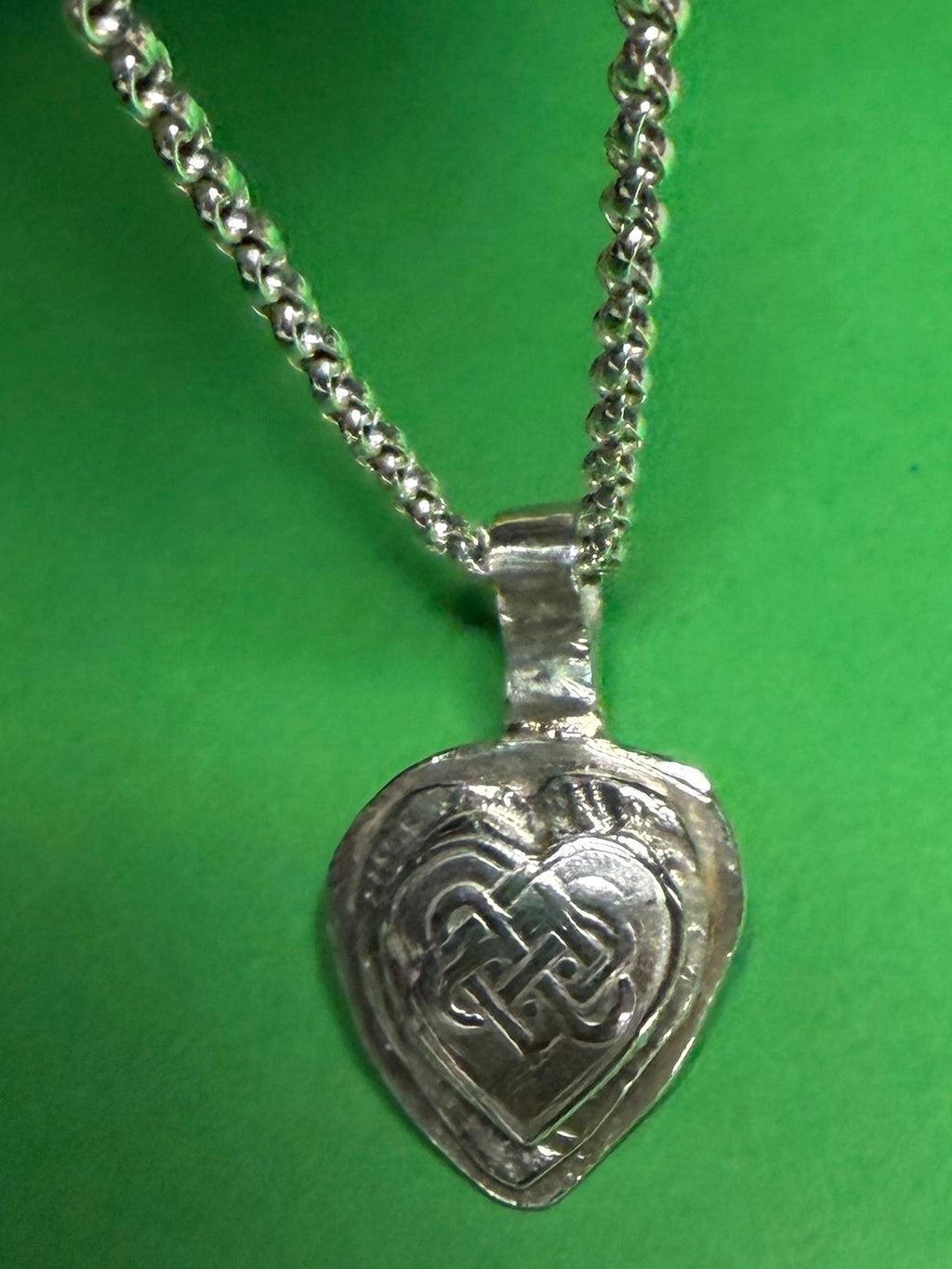 Handmade sterling silver Celtic heart with background on 18 or 20 inch chain.