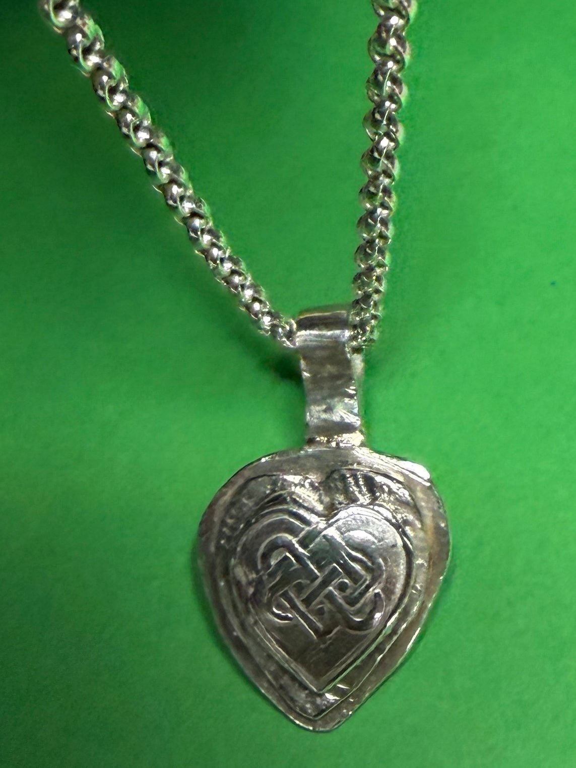 Handmade sterling silver Celtic heart with background on 18 or 20 inch chain.